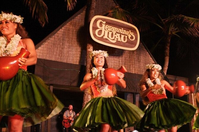 Oahu: Germaine's Luau - Outdoor venue comfort: sand, rain ponchos, hard seating, and the cat factor